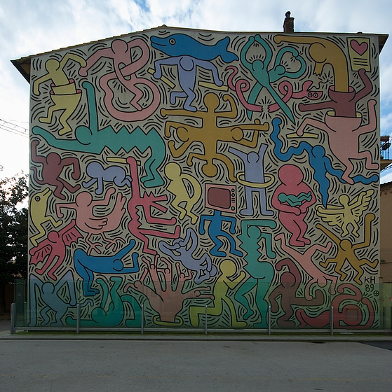 Tuttomondo een muurschildering van Keith Haring - Pisa | Secret World Trip Planner