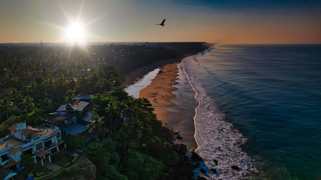 Varkala Beach: Red Cliffs and Arabian Sea Bliss - Varkala | Secret World Trip Planner