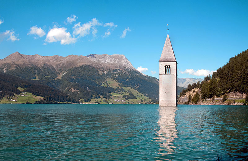Lake Resia Klokkentoren - Resia | Secret World Trip Planner